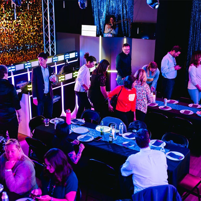 aerial view of employees eating catering food at game show